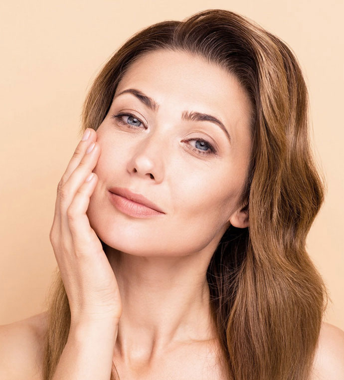 stock image of model putting her hand on her chin