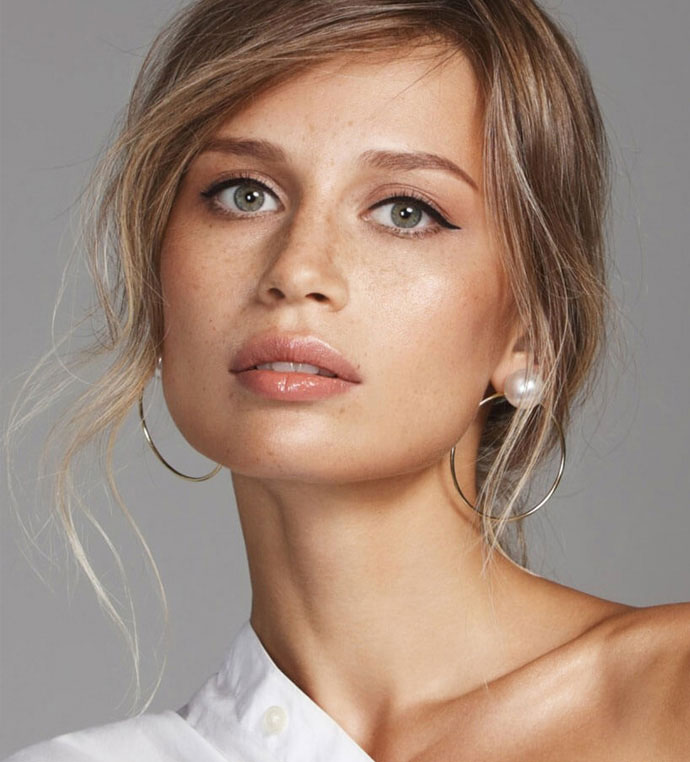 stock image of model with huge earrings